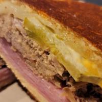 Cuban Sandwich · Ham, pork, Swiss cheese, pickles, mustard, mayo on Cuban bread.