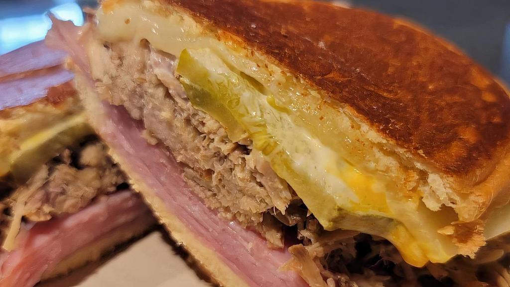 Cuban Sandwich · Ham, pork, Swiss cheese, pickles, mustard, mayo on Cuban bread.