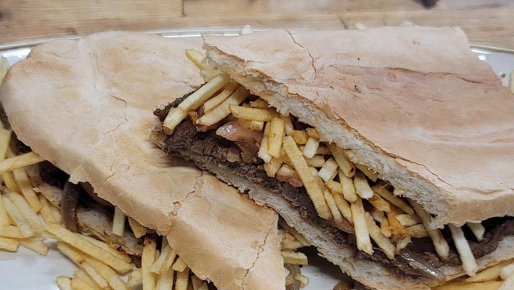 Steak Sandwich · Thin sliced grilled steak, grilled onions, tomato, string potato, and mayo on Cuban bread.