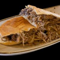 Pork Sandwich · Grilled pork mixed with onions, mojo sauce, and mayo on Cuban bread.
