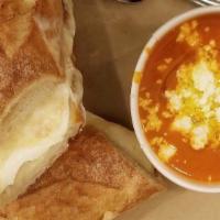 Garlic Bread Grilled Cheese · Fresh mozzarella, provolone, grana padano, served with tomato soup.