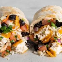 Crispy Baja Fish Burrito · Crispy plant-based battered fish, creamy jalapeno slaw, brown rice, ranchero beans, cilantro...