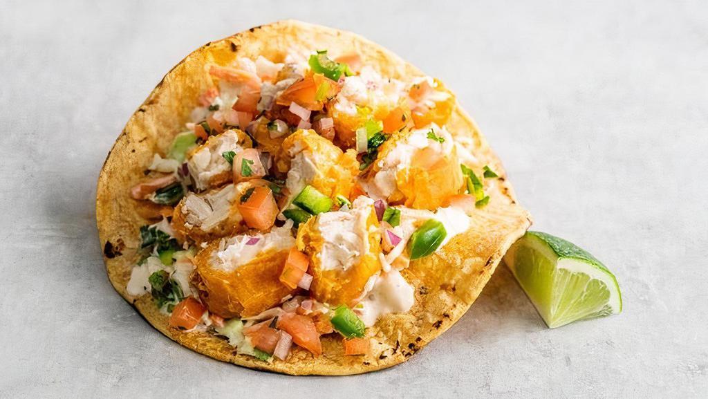 Crispy Baja Fish Taco · Crispy plant-based battered fish, creamy jalapeno slaw, cilantro, pico de gallo and a lime wedge | 290 cals..