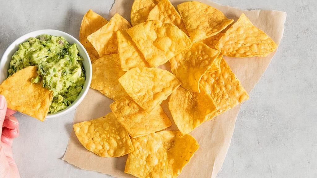 Chips + Guacamole · Crispy tortilla chips served with  house-made guacamole. Gluten-friendly. .