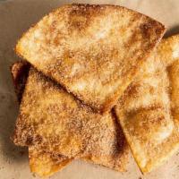 Buñuelos · Fried dough covered in cinnamon and sugar