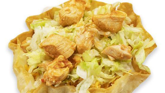 Taco Salad · Tortilla shell with bed of lettuce, beans, pico de gallo, your choice of red chilli chicken, or shredded beef, topped with cheddar and sour cream.