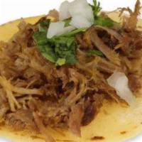 Carnitas · Corn tortilla, shredded pork, cilantro and onion.