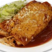 Chicken · Red chilli chicken wrapped with two corn tortillas, topped with enchiladas sauce, cheddar, j...