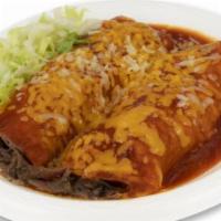 Beef · Shredded beef wrapped with two corn tortillas, topped with enchiladas sauce, cheddar, jack c...