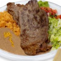 Carne Asada Plate · 2 thin carne asada steaks with guacamole, pico de gallo, lettuce, and tortilla on the side c...