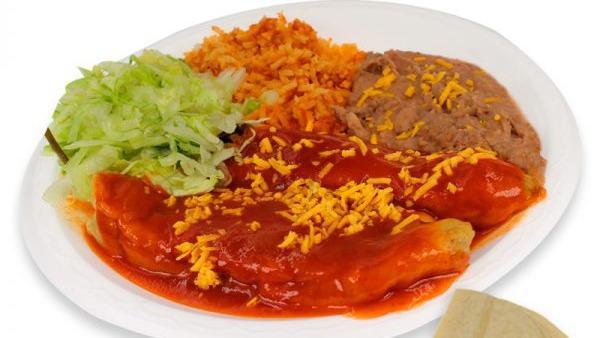 Chiles Rellenos · Two chiles rellenos smothered with enchilada sauce, lettuce, cheese, and tortillas on the side corn of flour.