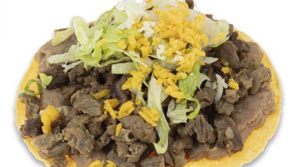 Carne Asada · Thin layer of beans, carne asada, cheddar, lettuce, topped with jack cheese.