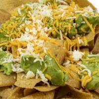 Chips With Guacamole · Covered with cheddar cheese, guacamole, topped with jack cheese.