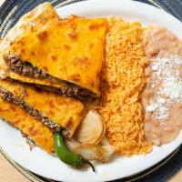 Quesadilla Meal · Cheese quesadilla stuffed with choice of protein, served with rice and beans