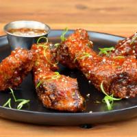 Thai Crispy Ribs · Lightly battered, crispy fried tender baby back ribs smothered in Thai BBQ sauce, topped wit...