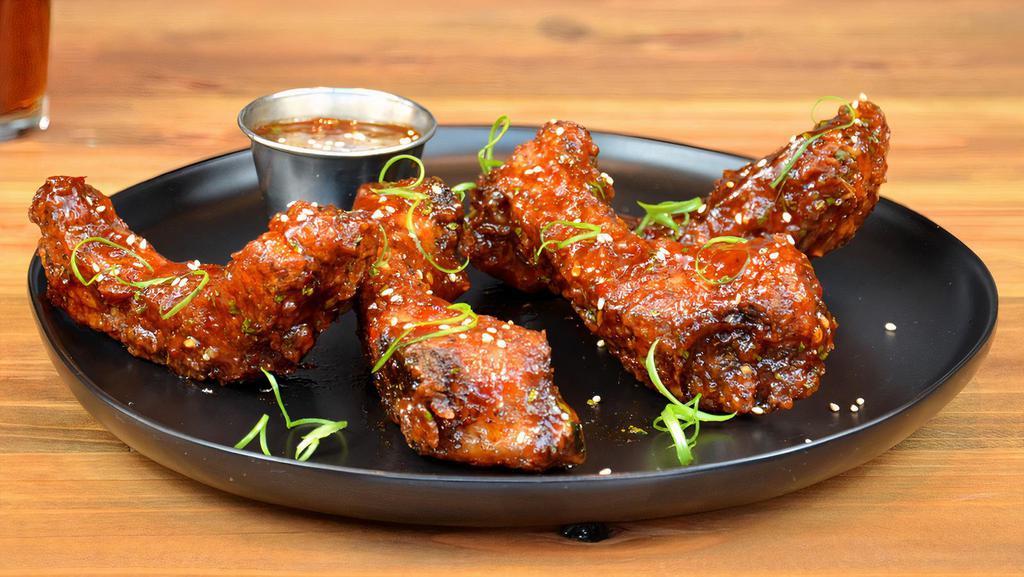 Thai Crispy Ribs · Lightly battered, crispy fried tender baby back ribs smothered in Thai BBQ sauce, topped with sesame seeds