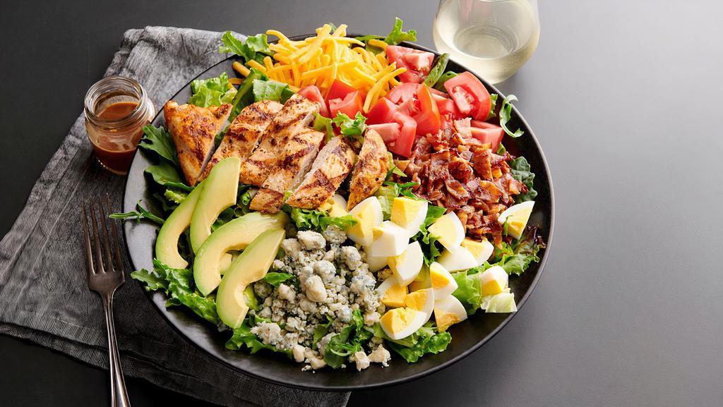 Southwest Cobb Salad · Blackened grilled chicken, bacon, romaine lettuce, avocado, red peppers, cheddar jack cheese, corn salsa, corn tortilla chips and hard-boiled egg. Served with southwestern ranch on the side
