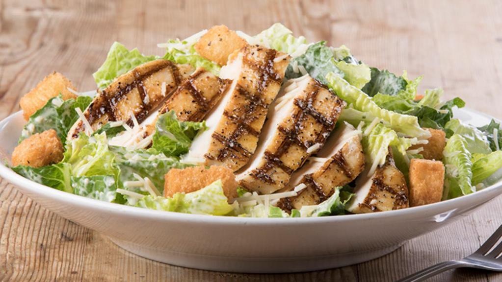 Grilled Chicken Caesar Salad · Grilled chicken, romaine lettuce, Parmesan cheese and croutons tossed with Caesar dressing