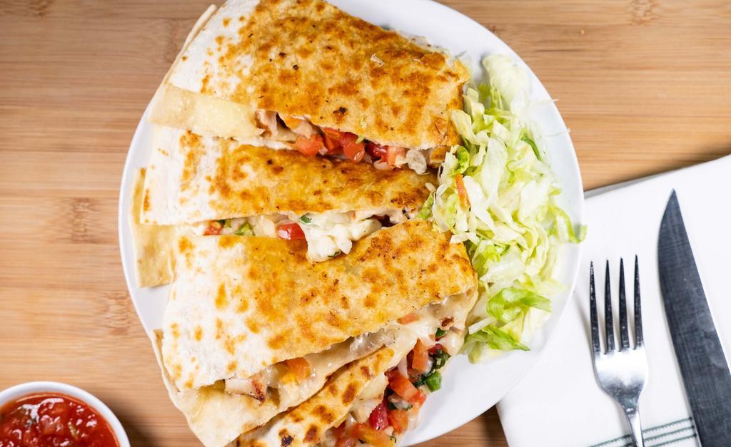 Quesadillas · A grilled flour tortilla with jack cheese, pico de gallo, and your choice of steak, grilled chicken, chorizo, or shrimp. Served with lettuce and scoops of sour cream and guacamole.