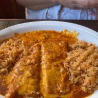 Enchilada Suiza · Two corn tortillas stuffed with filling topped with a delicious green tomatillo sauce and me...