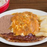 Huevos Rancheros · Three eggs over easy covered with sauce and melted cheese.