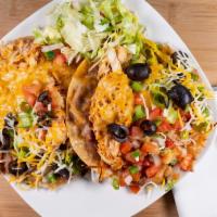 Tostadas · Two flat corn tortilla shells layered with refried beans and your choice of meat. Topped wit...