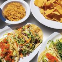 Family Taco Pack · Eight Citrus Slaw Tacos with (2) 12oz Rice and (2) 12oz Beans, (1 order) Chips & Salsa and (...