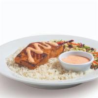 Salmon Bowl · Grilled with light soy marinade, served over rice and citrus slaw with a side of homemade ai...