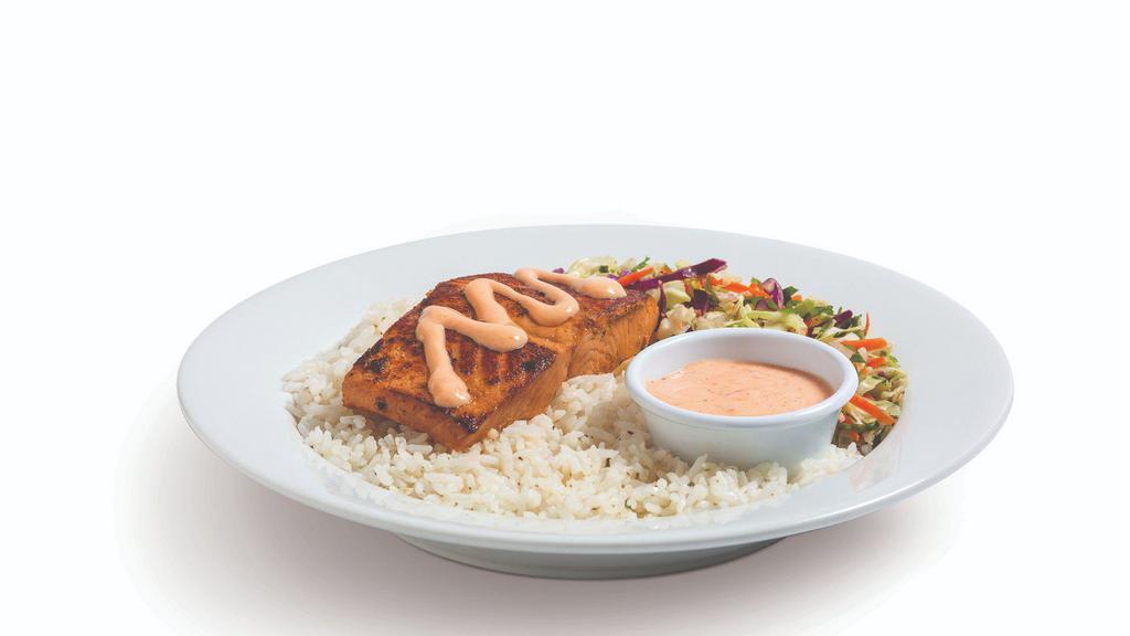Salmon Bowl · Grilled with light soy marinade, served over rice and citrus slaw with a side of homemade aioli.