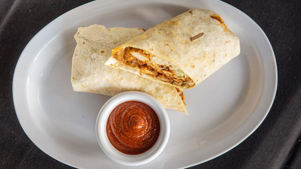 Lee'S Scream'N Burrito · Oversized flour tortilla with spicy chicken, rice, mushrooms, melted jack and cheddar cheese, green sauce and our famous Mr. Lee's Spicy chili sauce.