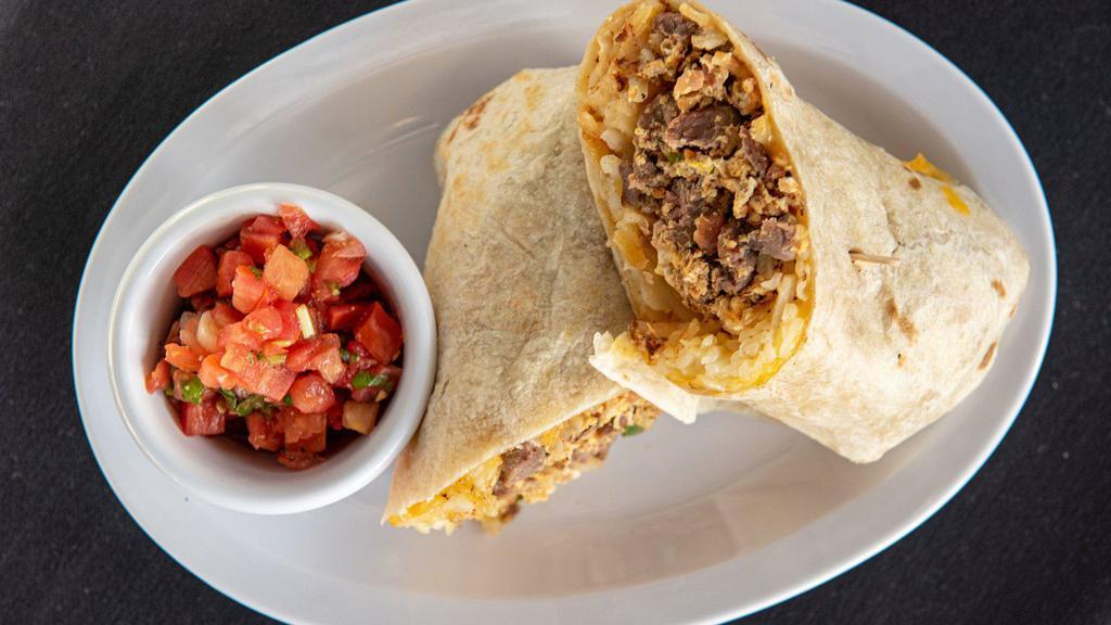 Asada & Egg Burrito. · Farm fresh eggs, scrambled with carne asada, bell peppers, diced onions, hashbrowns and melted cheese wrapped in a warm flour tortilla.