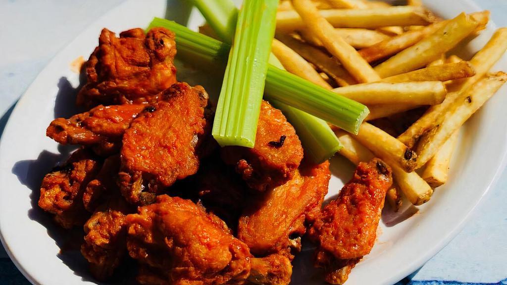 Wahoo'S Wings. · one pound of our large wings tossed on Buffalo, spicy bbq or sweet bbq sauce served fries and dressing on the side.
