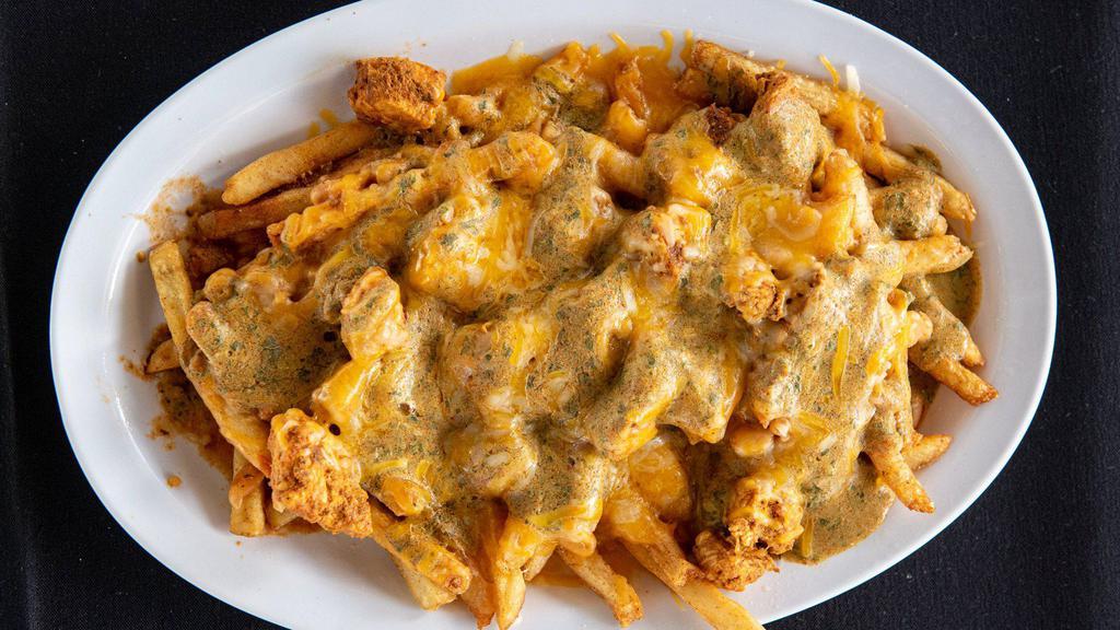 Wahoo'S Fries. · Golden fries with spicy chicken, spicy cajun white beans, melted jack and cheddar cheese topped with our famous fire sauce.