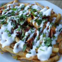 Loaded Fries. · Golden fries with melted jack and cheddar cheese topped fresh grilled onions, crispy bacon, ...