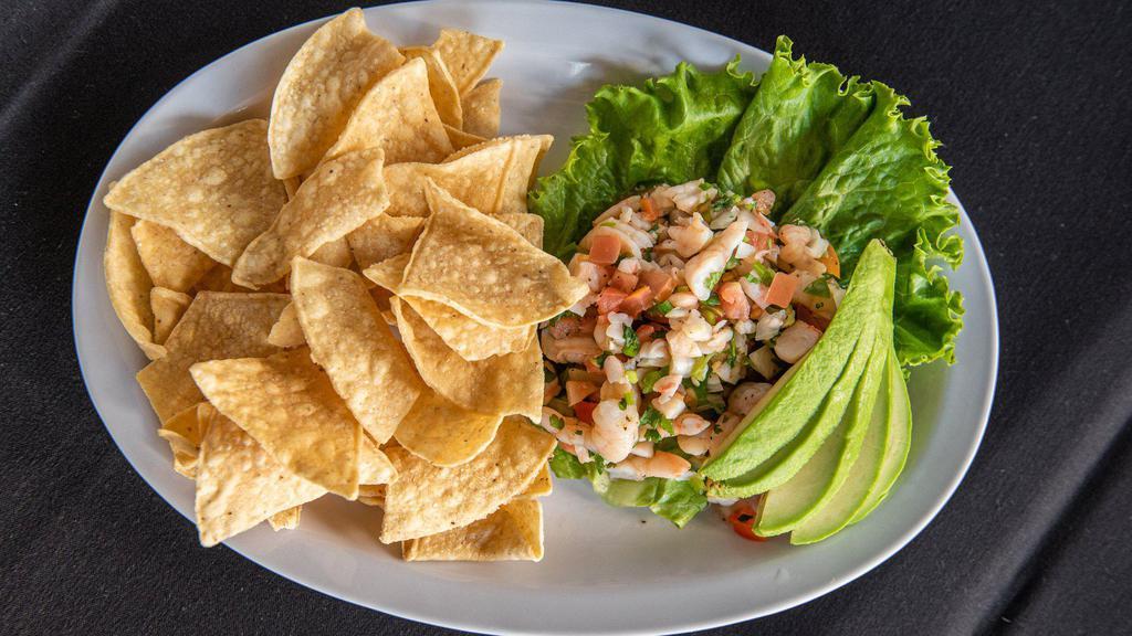 Ceviche. · Shrimp, Green Onions, Tomato, Cilantro, Jalapeño, Pico De Gallo, Fresh Lemon Juice and Lime Juice, Avocado Slices and Chips