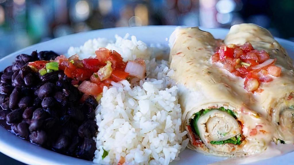Baja Rolls. · Oversized flour tortilla with cream cheese, chopped chicken breast, baby spinach and dried pico de Gallo, served with our famous roasted pepper cilantro sauce.