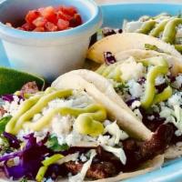 Street Style Taco. · Your choice of protein with cabbage mix, maria salsa and queso fresco