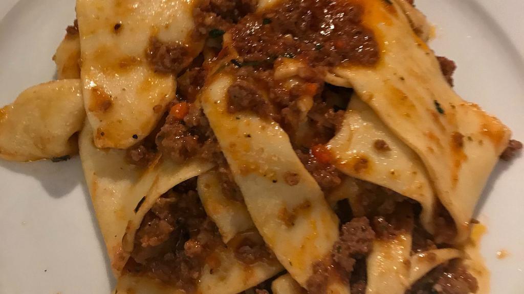 Bolognese Ragu · Housemade tagliatelle with our famous ragu with 7 meats.