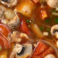 Tom Yum · Lemongrass, kaffir lime, mushrooms, onion and tomatoes in a spicy chili broth and lime juice...