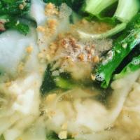 Wonton Soup · Stuffed chicken wontons in clear broth with fresh spinach top with cilantro and garlic.