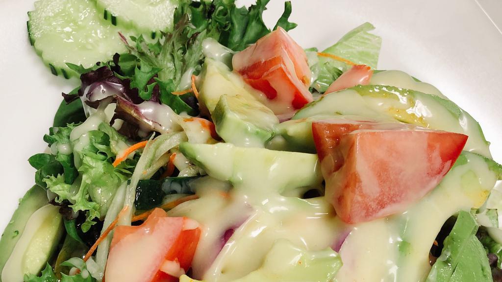 Green Salad With Avocado · Mixed greens, avocado, tomatoes, red onion with homemade dressing.