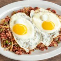 Corned Beef Hash & Eggs · Corned beef brisket grilled with peppers, onions, & red potatoes. Served with two eggs. Choi...