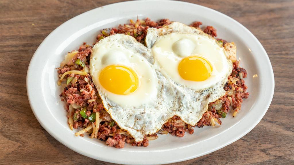 Corned Beef Hash & Eggs · Corned beef brisket grilled with peppers, onions, & red potatoes. Served with two eggs. Choice of hash browns & toast, or two pancakes.