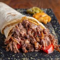 Machaca Breakfast Burrito · Shredded beef tossed with egg, bell peppers, onion and tomato. Served in a satisfying burrito.
