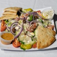 Fat Greek Salad · Crisp romaine heart, tomatoes, cucumber, crumbled feta, red onion, and kalamata olives. Serv...
