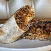 Ate Layer Burrito · Black beans, cheddar, rice, salsa roja, lettuce, onions, sour cream, and avocado