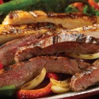 Steak And/Or Chicken Fajitas For Two · Premium carne asada steak and grilled chicken combo, served atop sauteed peppers and onions ...