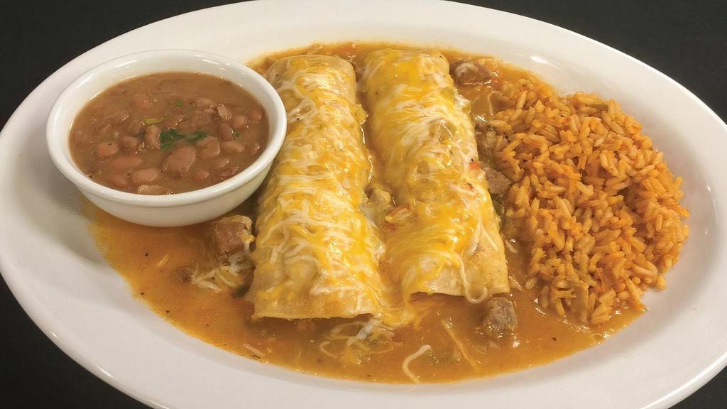 Chicken Enchiladas · Choose between two or three chicken enchiladas with new mexico hatch green chile sauce. Served with Mexican rice and frijoles a la charra.