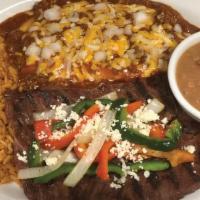 Steak & Enchilada Dinner · Our flavorful Carne Asada paired with sautéed veggies, crumbled cotija cheese, and two chees...