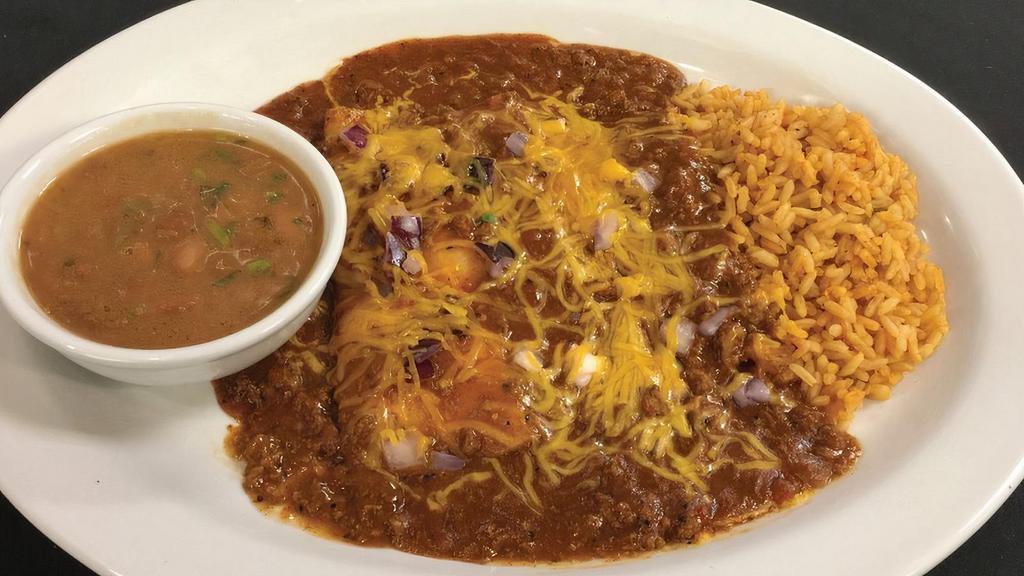 Cheese & Onion Enchiladas · Choose between two or three cheese enchiladas with homemade salsa carne. Served with Mexican rice and frijoles a la charra.